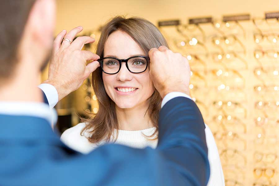 Woman being fitted for new eyeglasses